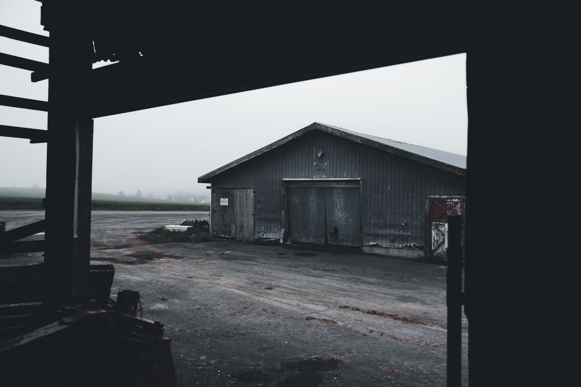 A foggy, abandoned building corridor evoking the atmospheric dread of classic survival horror settings