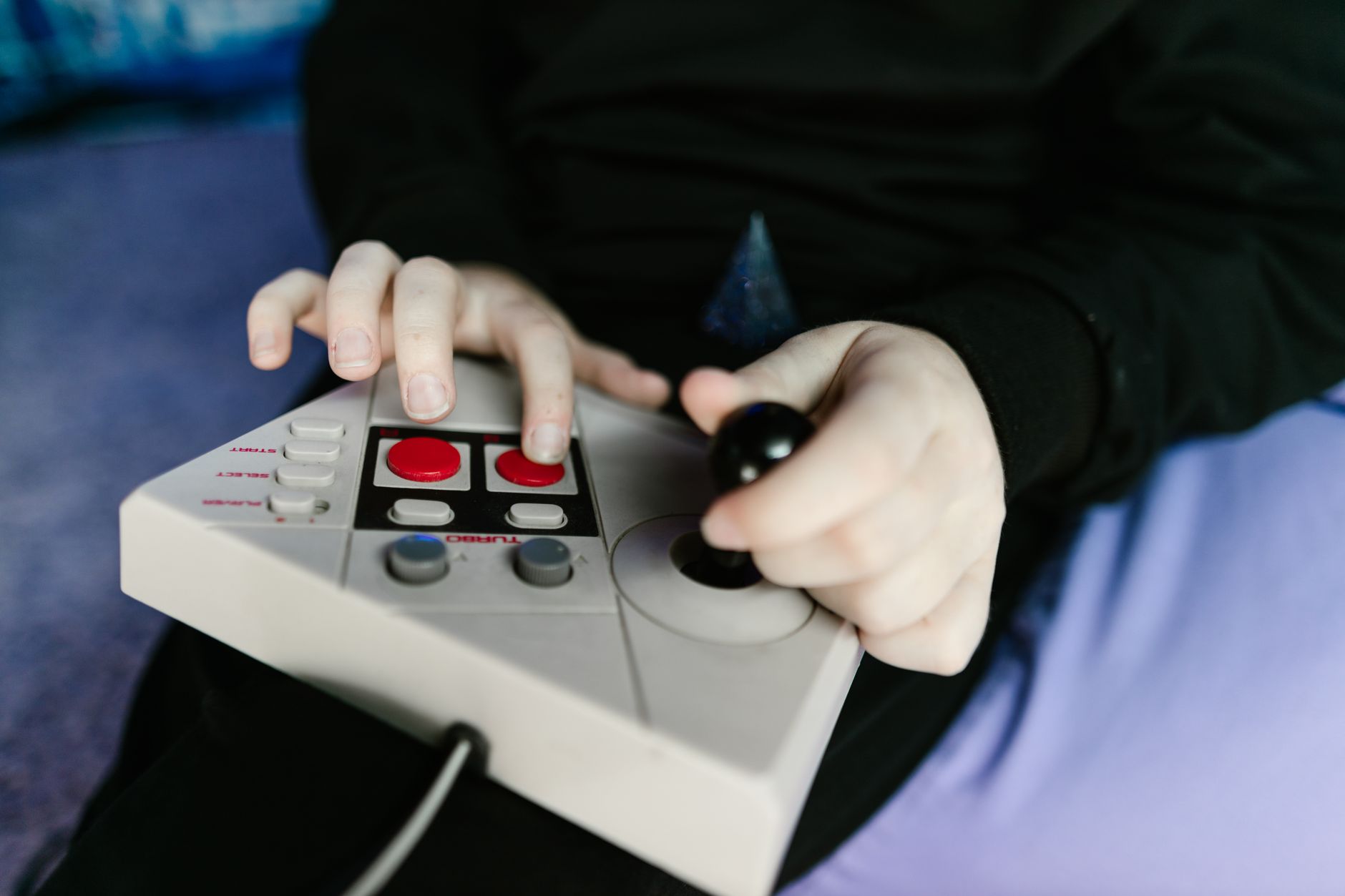 Close-up of a game controller representing cooperative gaming mechanics