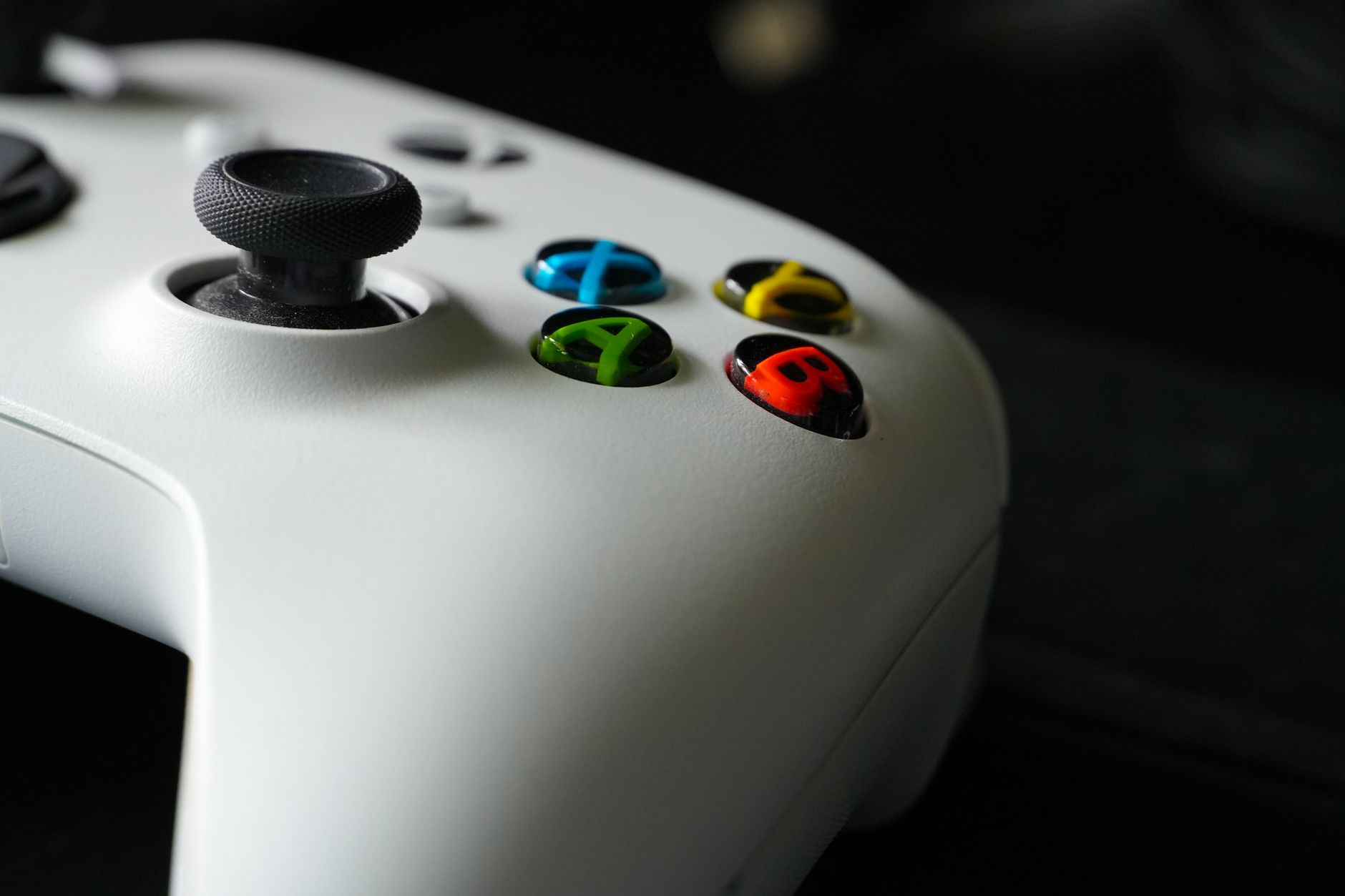 Close-up of a game controller representing console and handheld gaming options