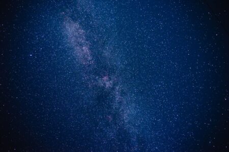 Bethesda’s Starfield DLC Silence Is Funneling Players Back to No Man’s Sky A vast galaxy viewed from space, representing the open-universe setting of space exploration games