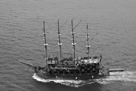 A tall sailing ship on open ocean waters, evoking the naval setting of Assassin's Creed Black Flag