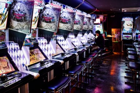 Sega’s Virtua Fighter 6 Buzz Is Cooling Dead or Alive 6 Lobbies Close-up of arcade fighting game cabinet controls with colorful buttons