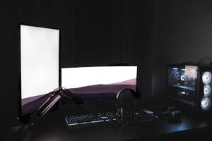 Valve’s Half-Life 3 Silence Is Pulling Fans Back to Alyx A dark gaming setup with glowing monitor, representing immersive PC gaming culture