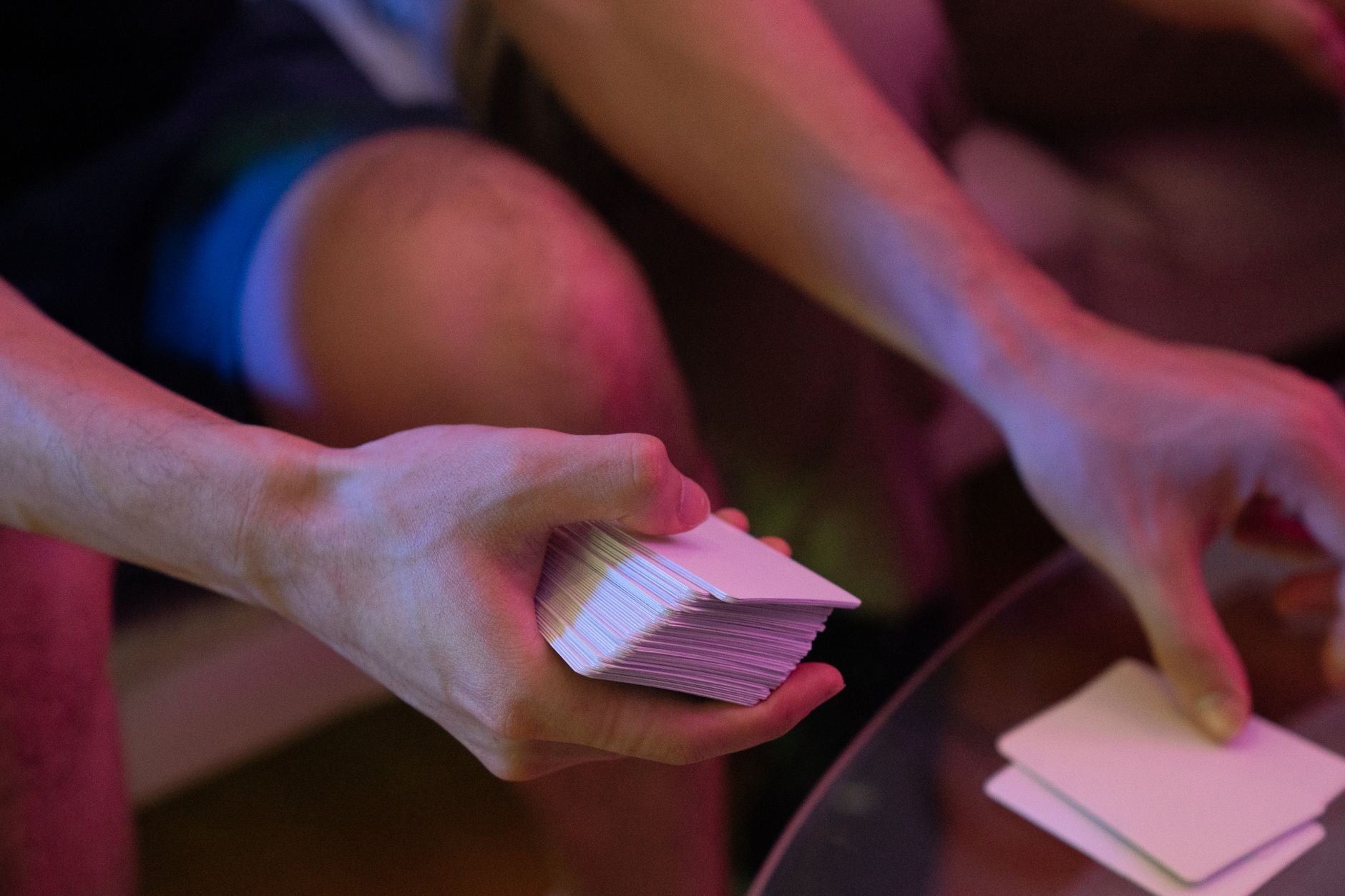 Close-up of collectible card game cards spread across a gaming table