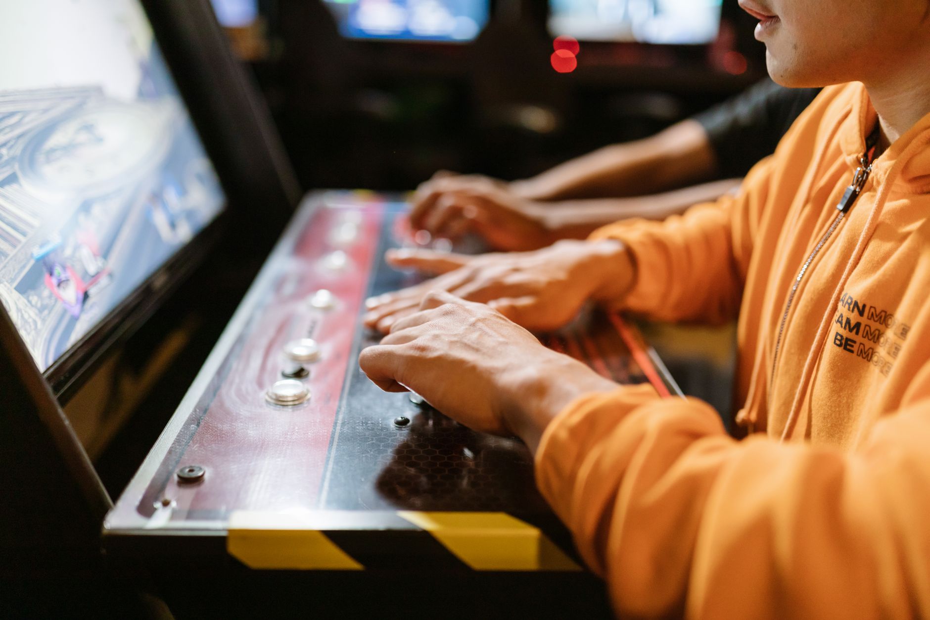 A retro arcade cabinet lit up in a darkened room, evoking classic fighting game history