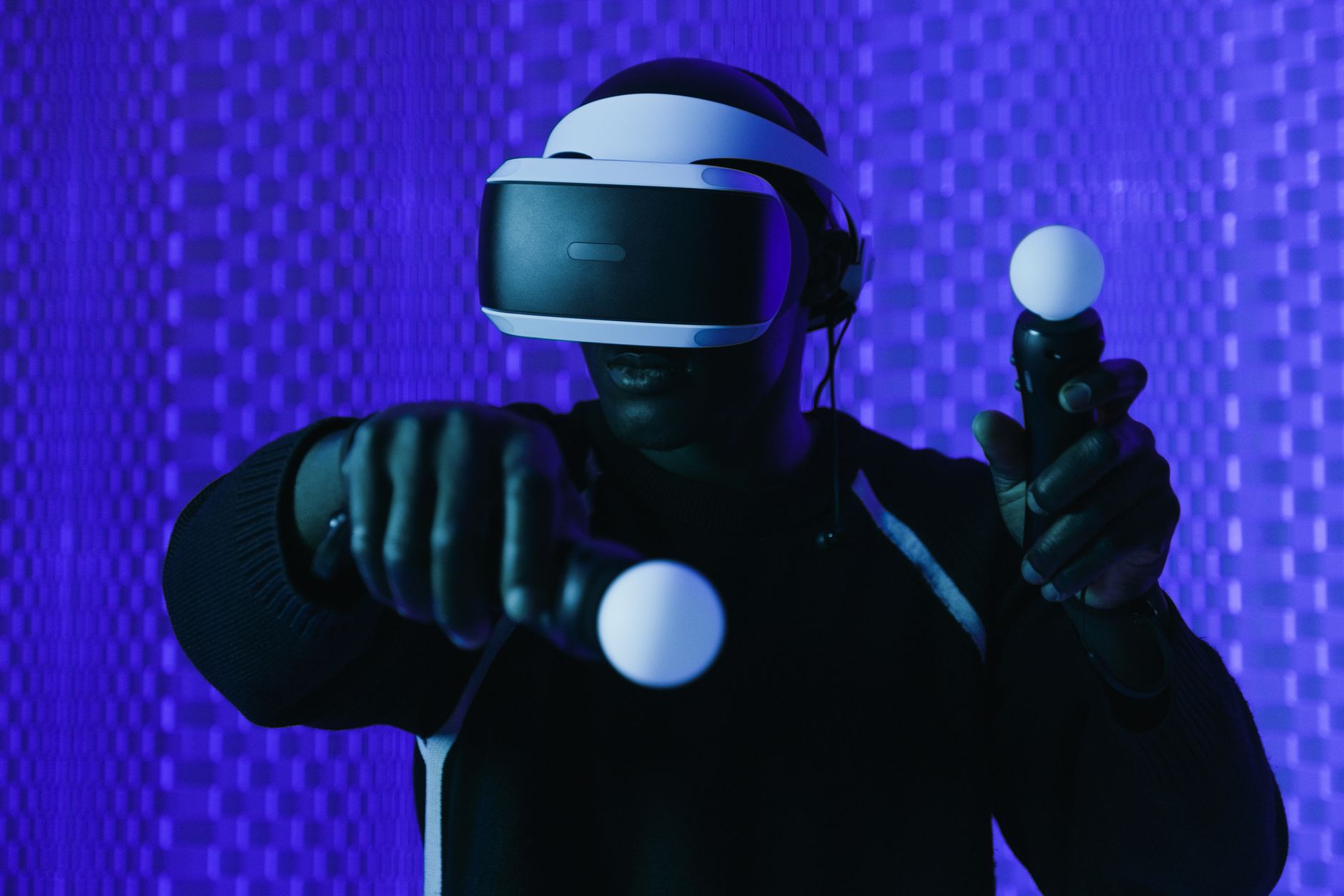 A person wearing a virtual reality headset during gameplay