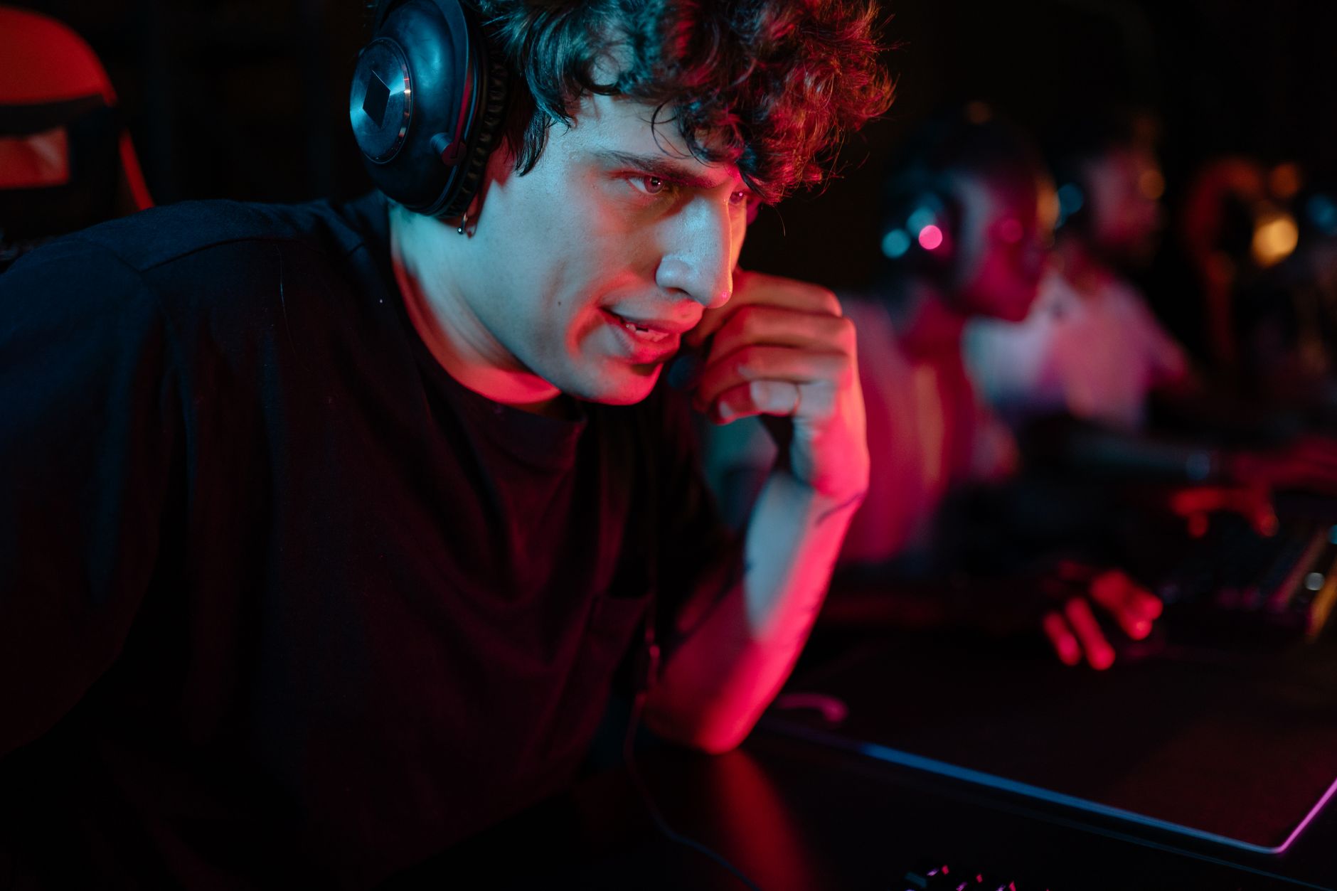 A dark gaming monitor glowing in a dim room, representing an unresolved narrative cliffhanger