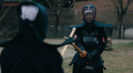 A samurai warrior in traditional armor, evoking the setting of Ghost of Tsushima
