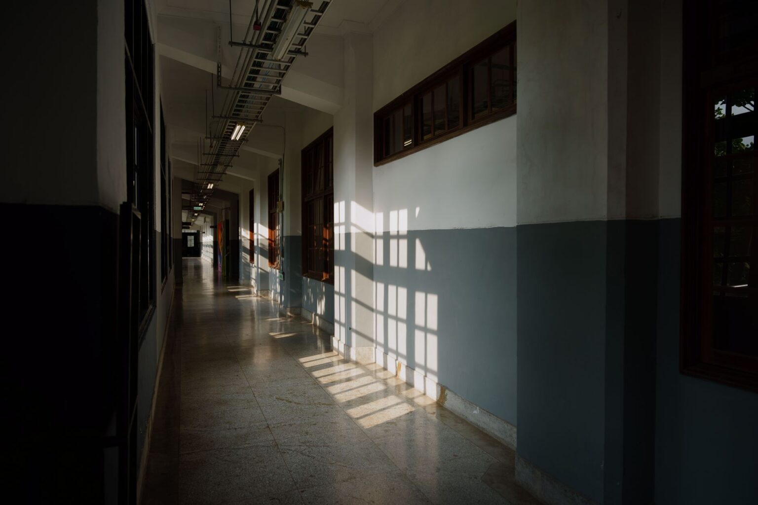 Empty school hallway with lockers, representing the Bullworth Academy setting from the Bully video game