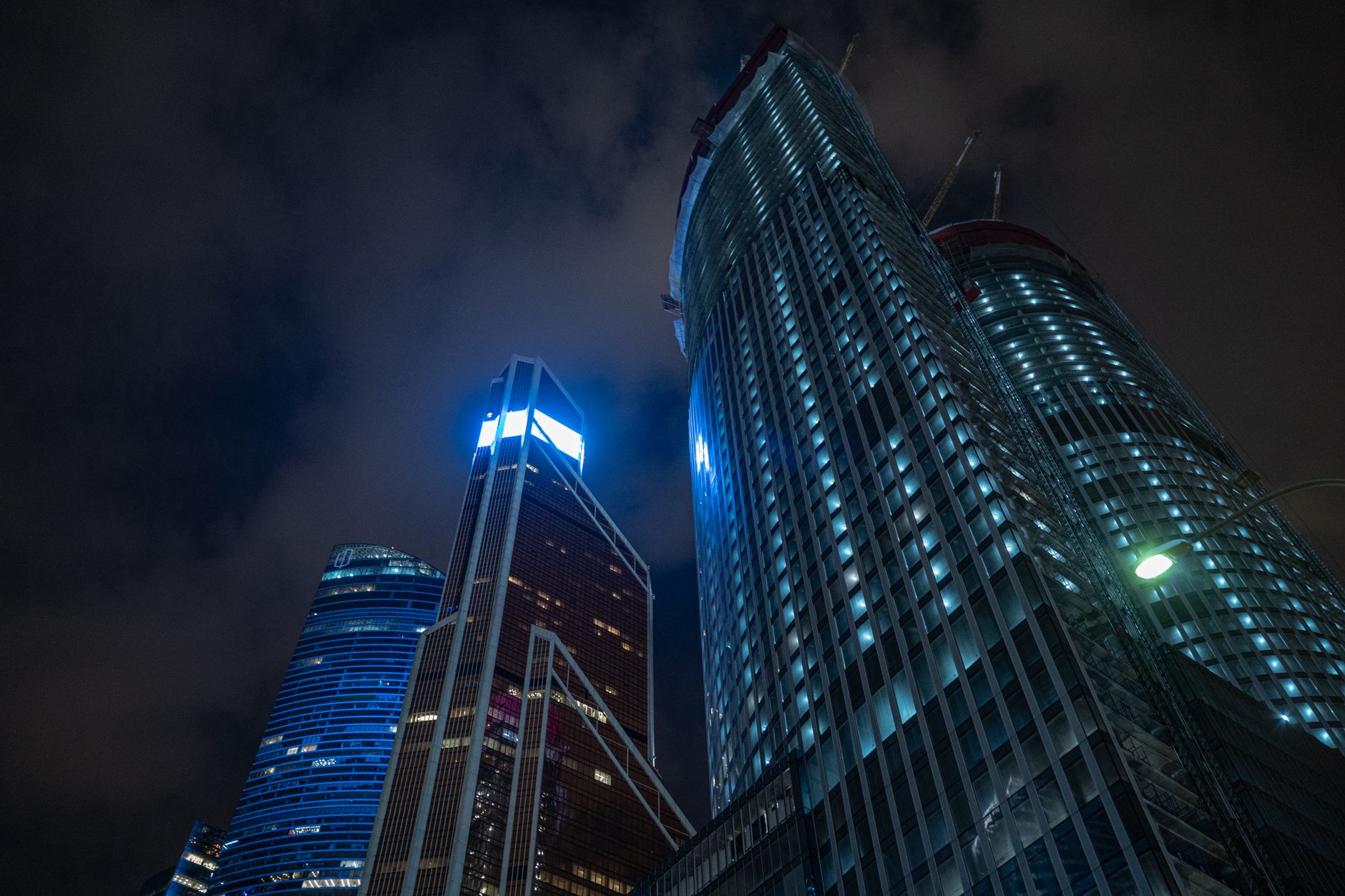 A dark futuristic city skyline representing the atmospheric setting of upcoming sci-fi games like Pragmata