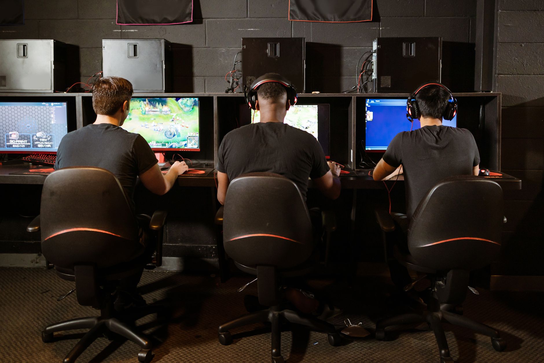 Multiple screens in a gaming setup representing cooperative multiplayer sessions in Wonderlands