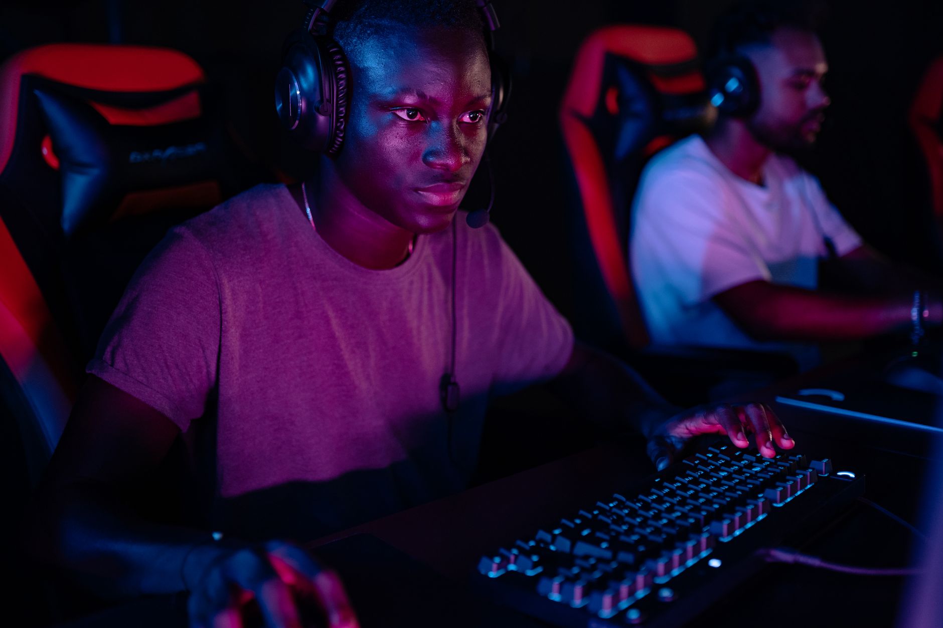 A person watching a gaming stream on screen, representing the speedrunning viewer community