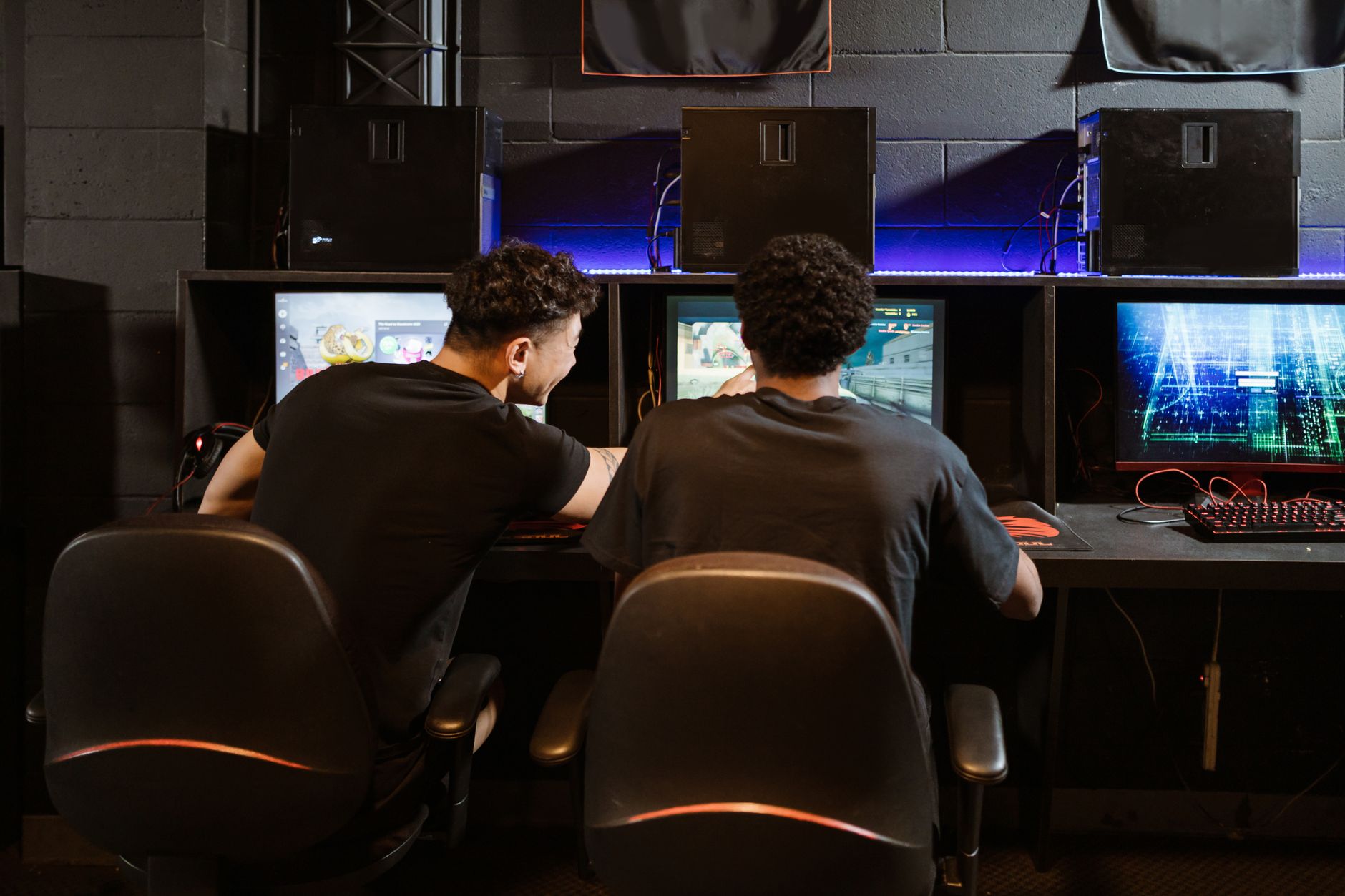 A gaming desk setup with multiple monitors suggesting a dedicated speedrunning environment